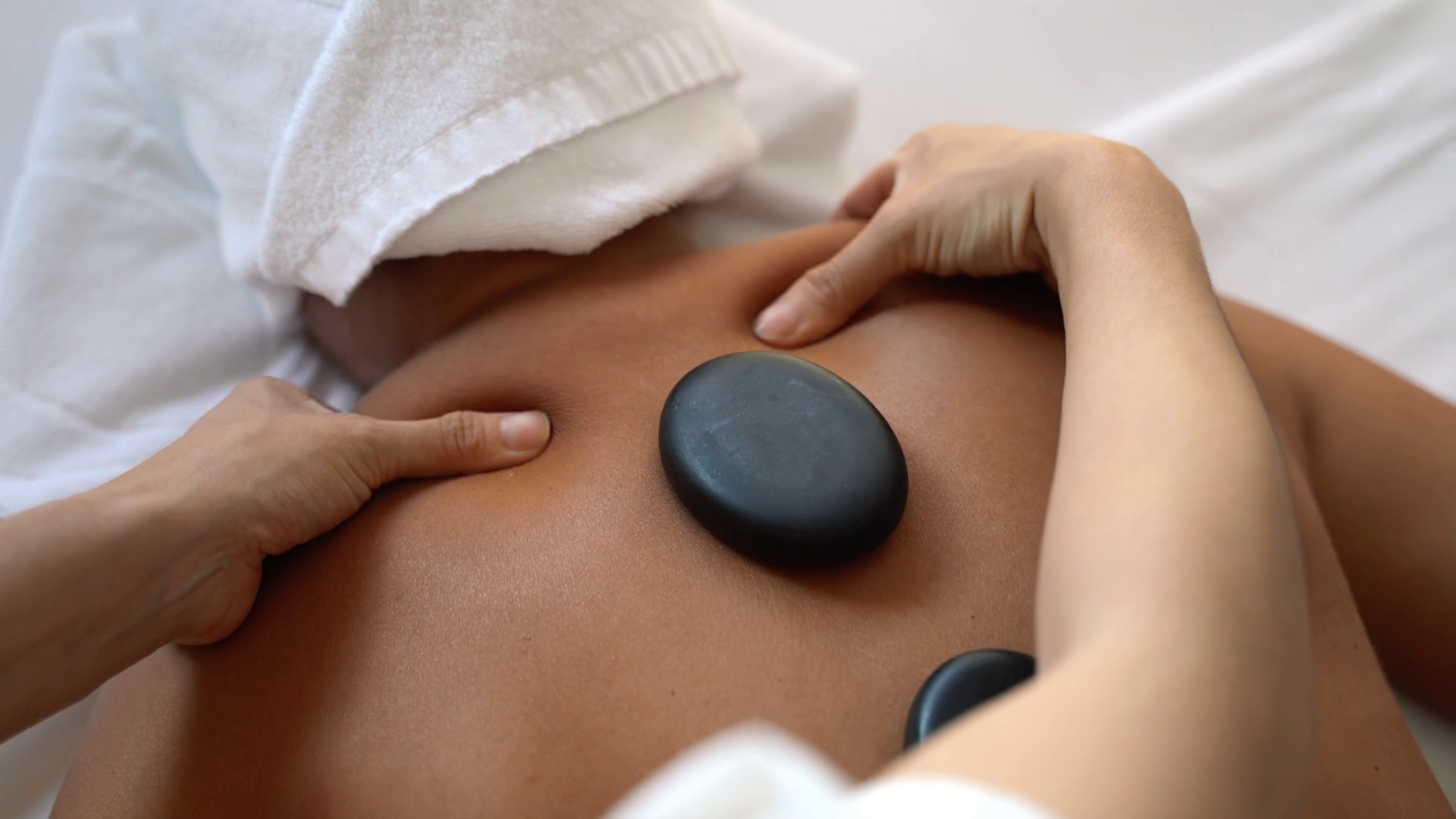 FourWing Organic Wellness Hub hot stone therapeutic massage in Lagos